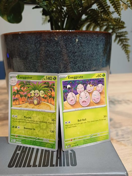2 Pokémon Cards: Exeggcute #102 and Exeggutor [Reverse Holo] #103