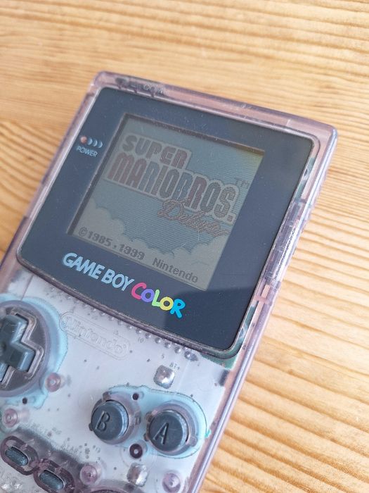 Gameboy roxo e jogo Harry Potter