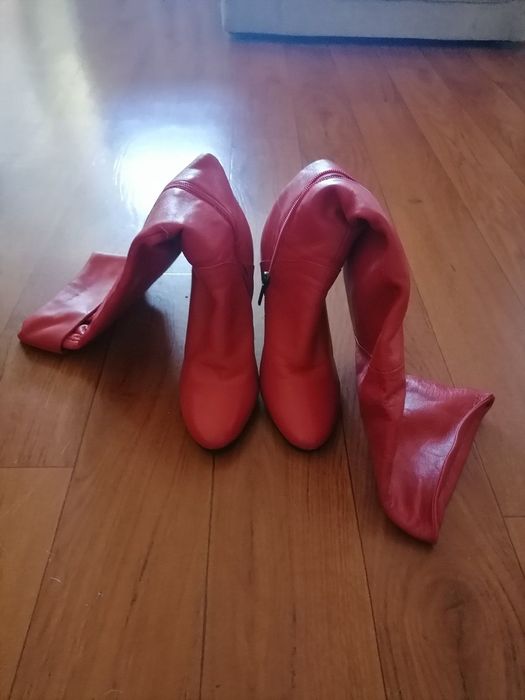 Шкіряні ботфорти .