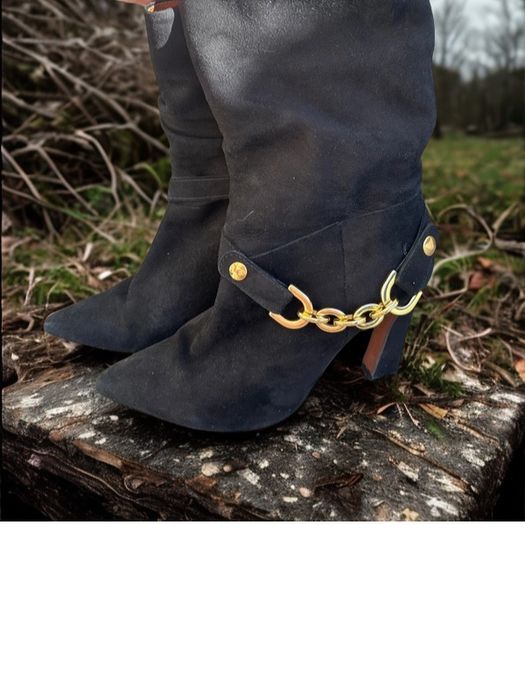 Botas pretas com salto da Ruikä