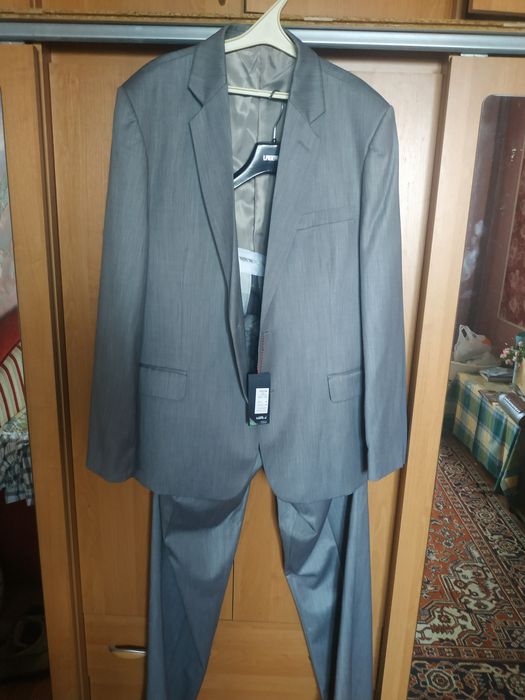 Продам новый костюм мужской на высокий рост 56 размер