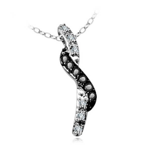 piękny wisiorek z czarnymi i białymi diamentami w białym złocie