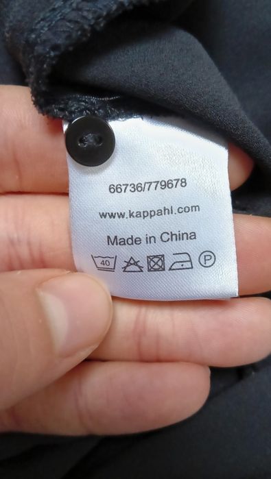 Czarny kombinezon KappAhl