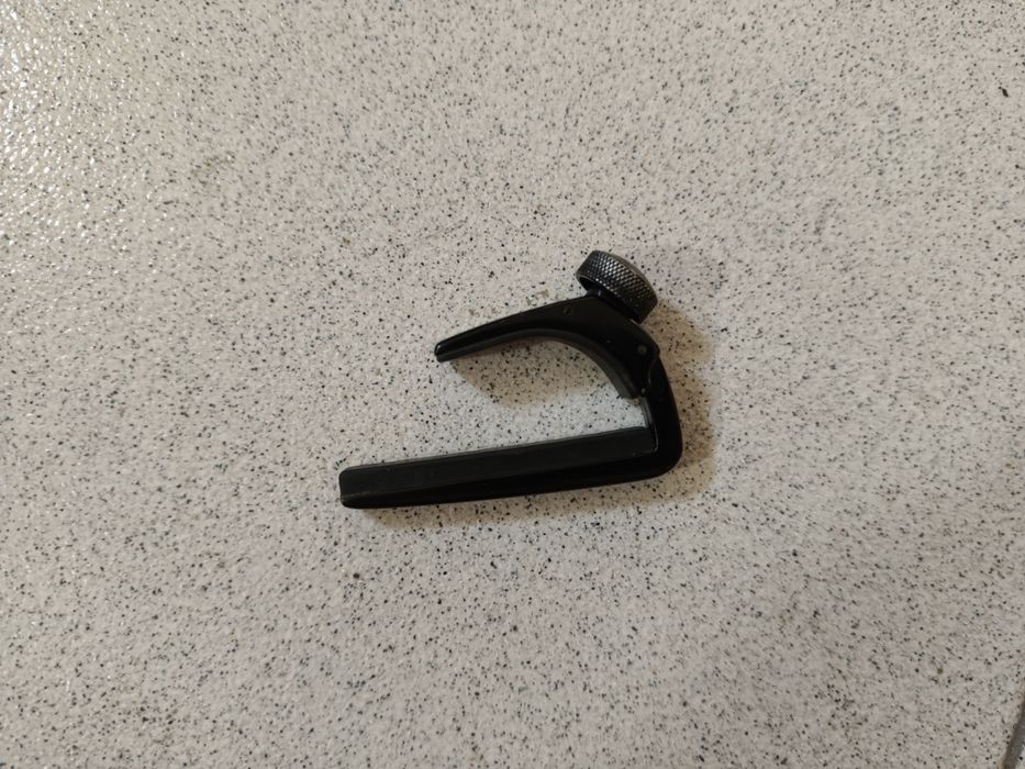 Capo para guitarra