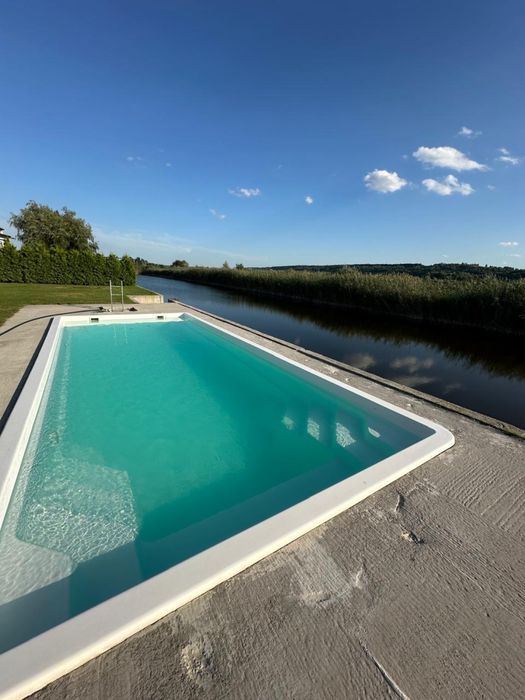 КМ Water village Продаж 1 поверхових будинків 330 м² з виходом на воду з басейном ділянки від 10 соток Романків Киівська область Новообухівська траса