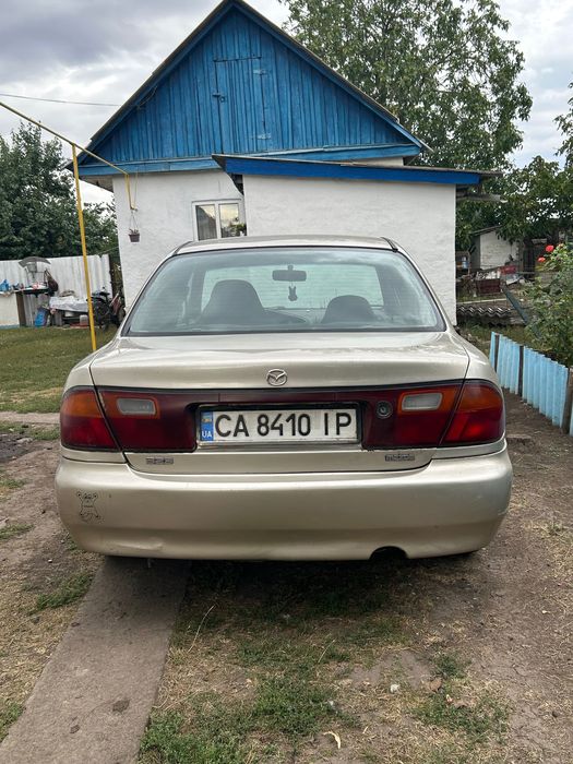 Машина мазда 323