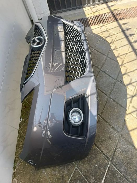 Para choques Mazda 5 2009