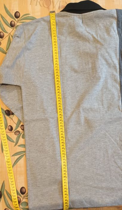 Polo de manga comprida e fecho