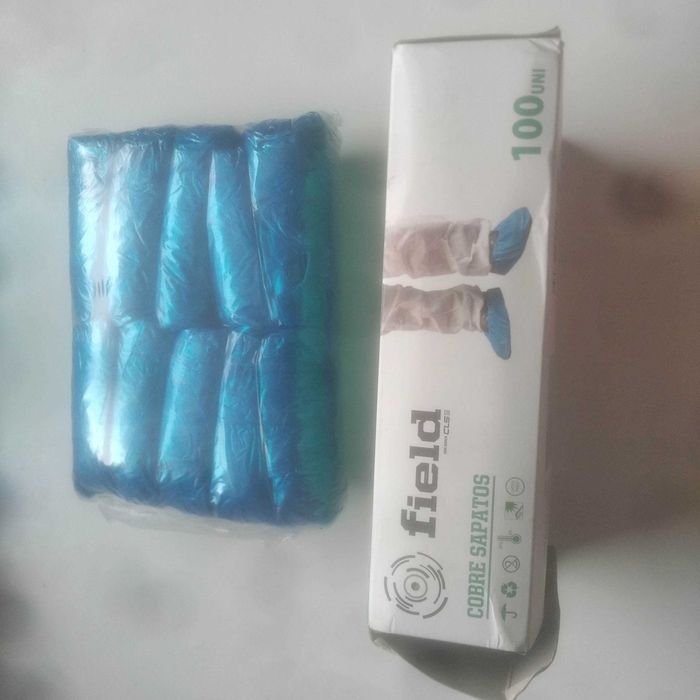 Caixa nova 100 unidades azuis Capas de protecção de pés / sapatos polietileno (cobre / protege)