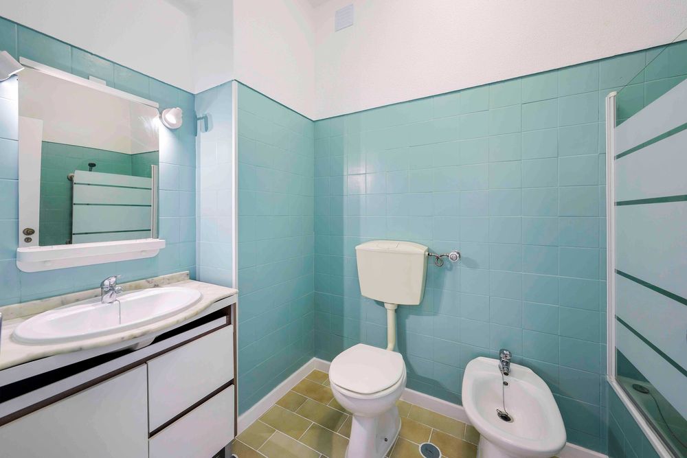 T2+1 renovado com vista rio varanda na sala e cozinha