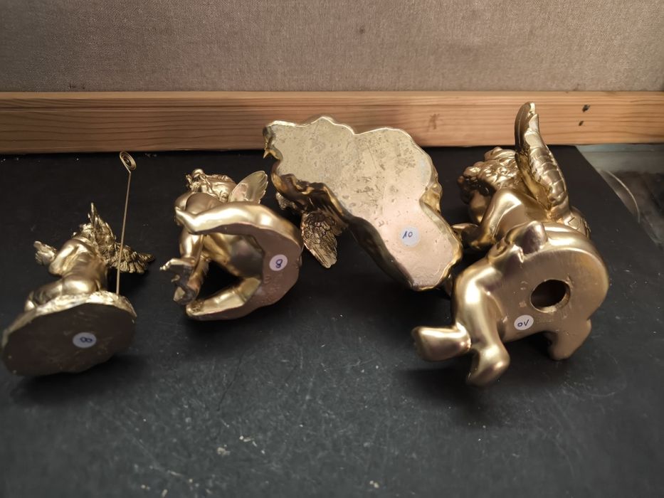 Conjunto de 4 anjos dourados.
Conjunto decorativo de quatro anjos em d