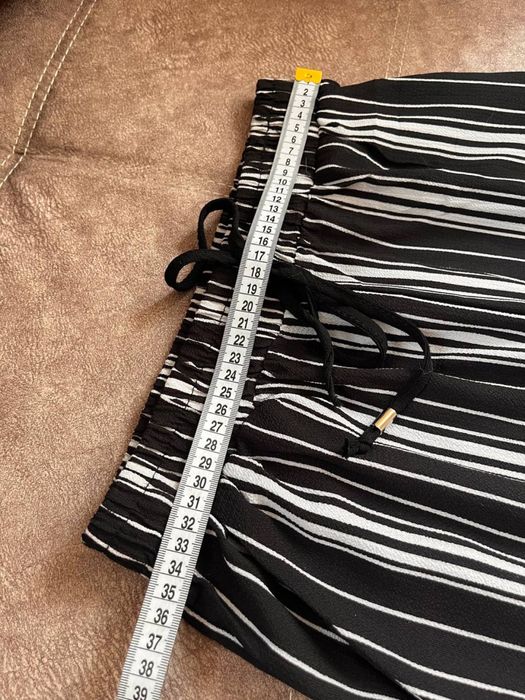 штани в смужку L