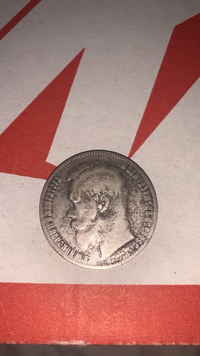 Серебреная монета и долары