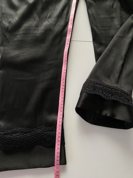 Czarne spodnie z połyskiem i koronką H&M