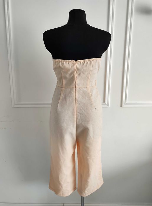 długi kombinezon bez ramiączek z kokardą, długie i szerokie spodnie