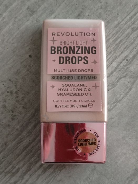 Nowe zapieczetowane krople brązujące light/med Revolution