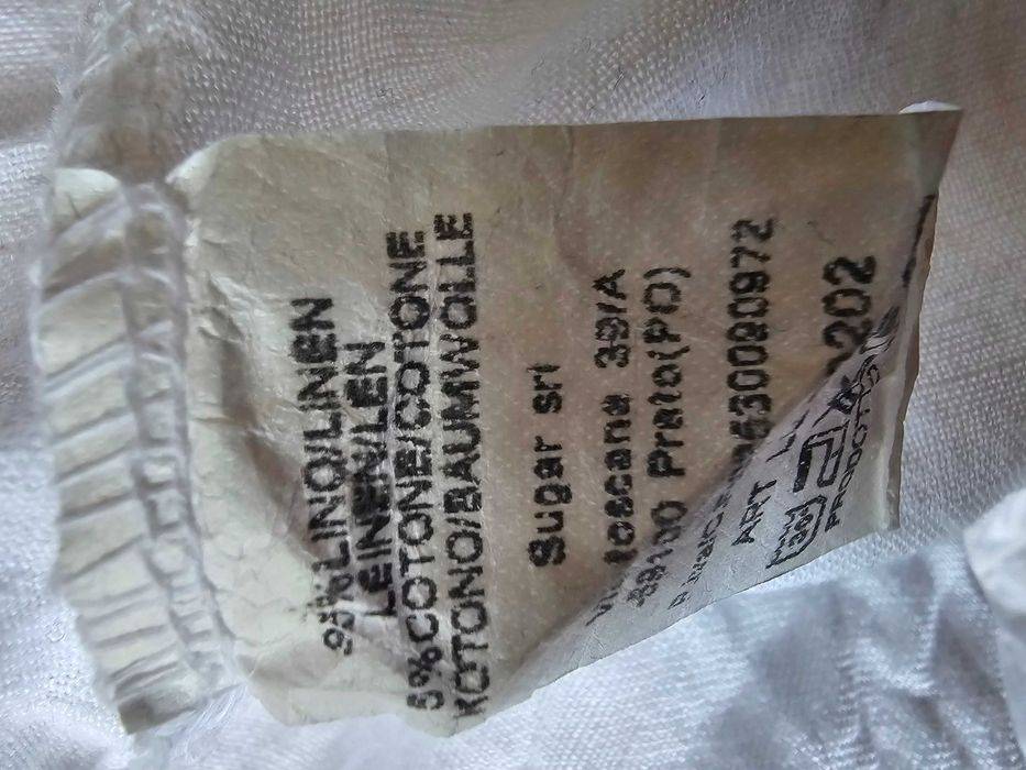 Spodnie lniane z guzikami na kieszeniach