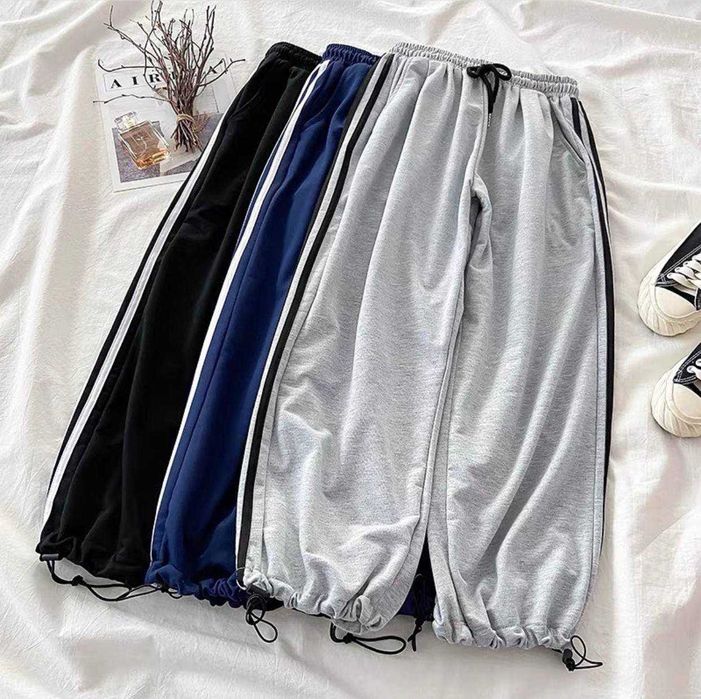Жіночі спортивні штани з лампасами полосками збоку і затяжками знизу