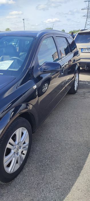 Opel Astra H універсал 1.8
