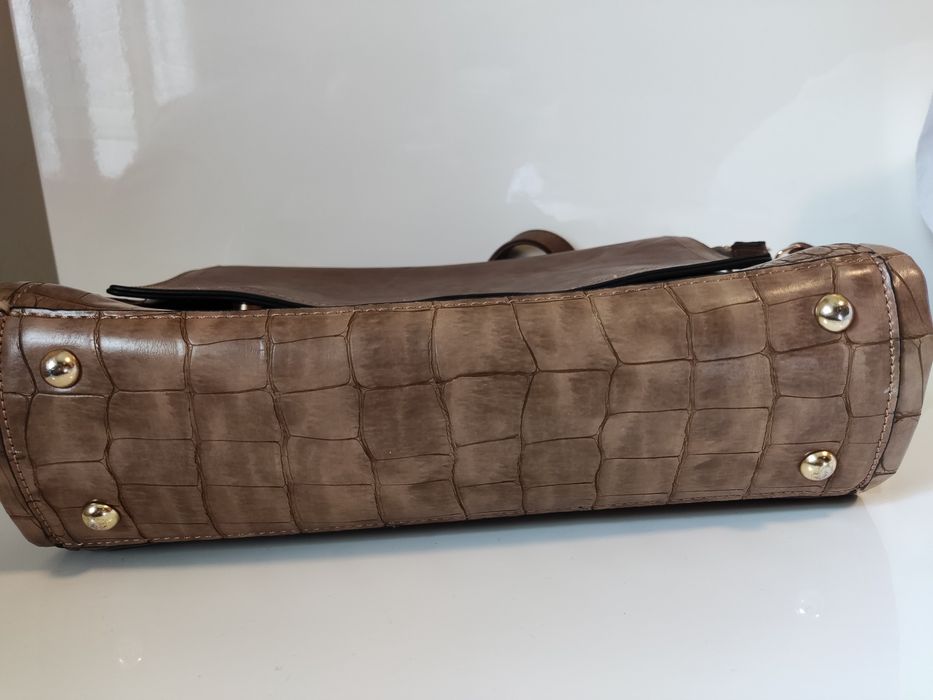 Mala castanha em pele