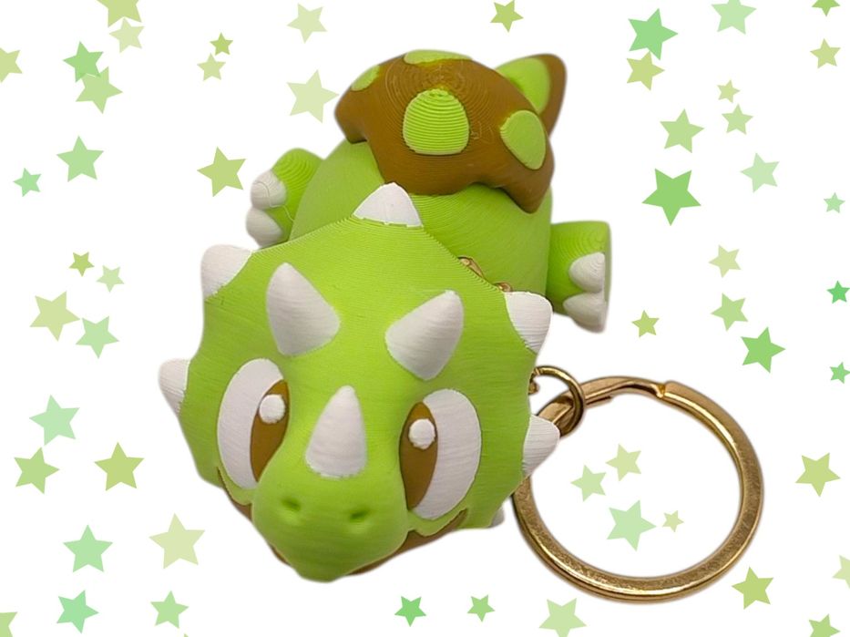 Brelok dinozaur triceratops zielony uroczy dodatek ruchomy breloczek