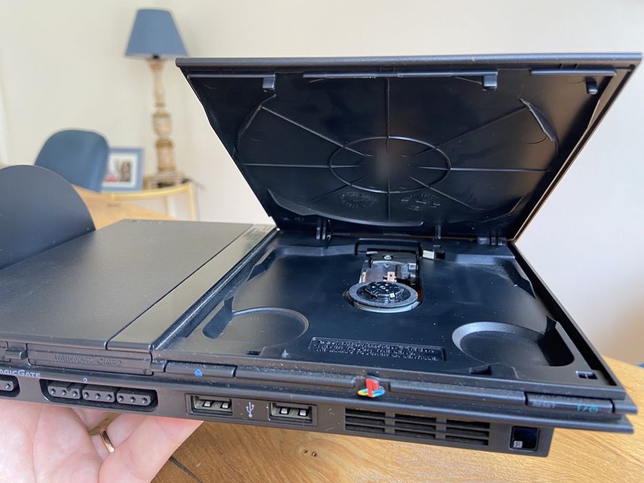 Selling PS2 Slim with vertical stand, 2 controllers, and 7 games64409139350786121