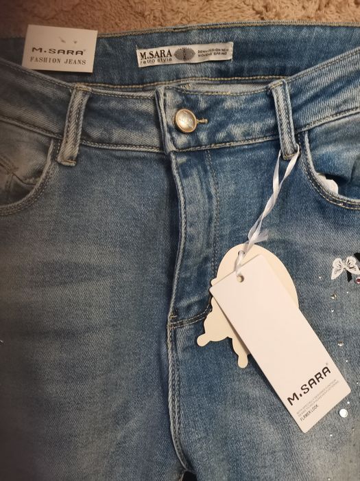 Nowe spodnie niebieskie M Sara 31 push up cekiny motyle