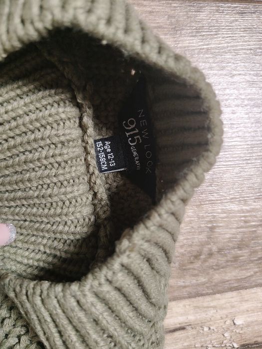 Krótki ażurowy sweter dla dziewczynki rozm 146-152