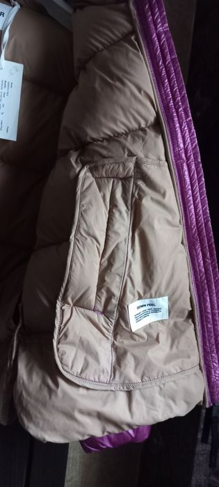 Продам женский пуховик 100%пух.фирма DEKKER из Италии