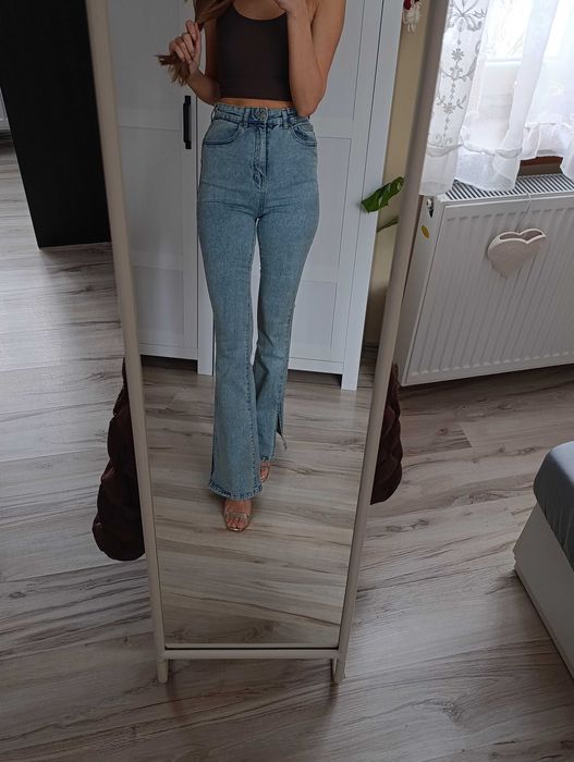 Spodnie jeansowe wysoki stan dzwony rozcięcia spodnie jeansowe