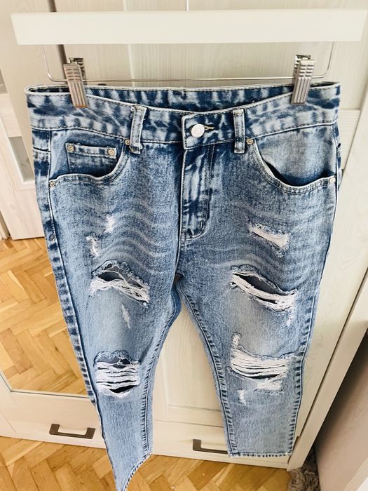 Nowe spodnie jeansowe L przetarcia mommy