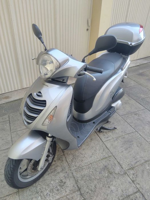 Honda PS 125i impecável.