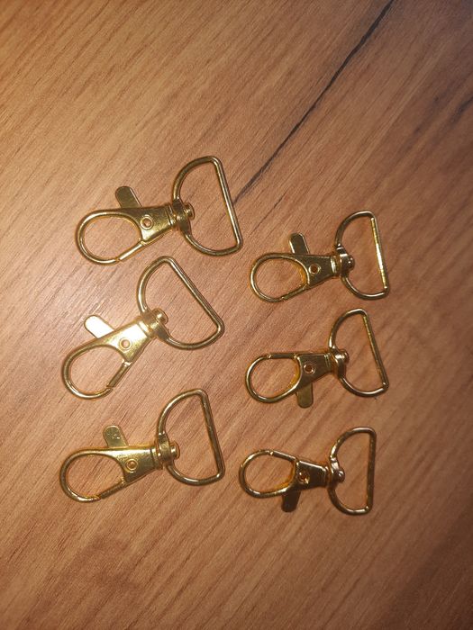 Złote, obrotowe klamry do torebki