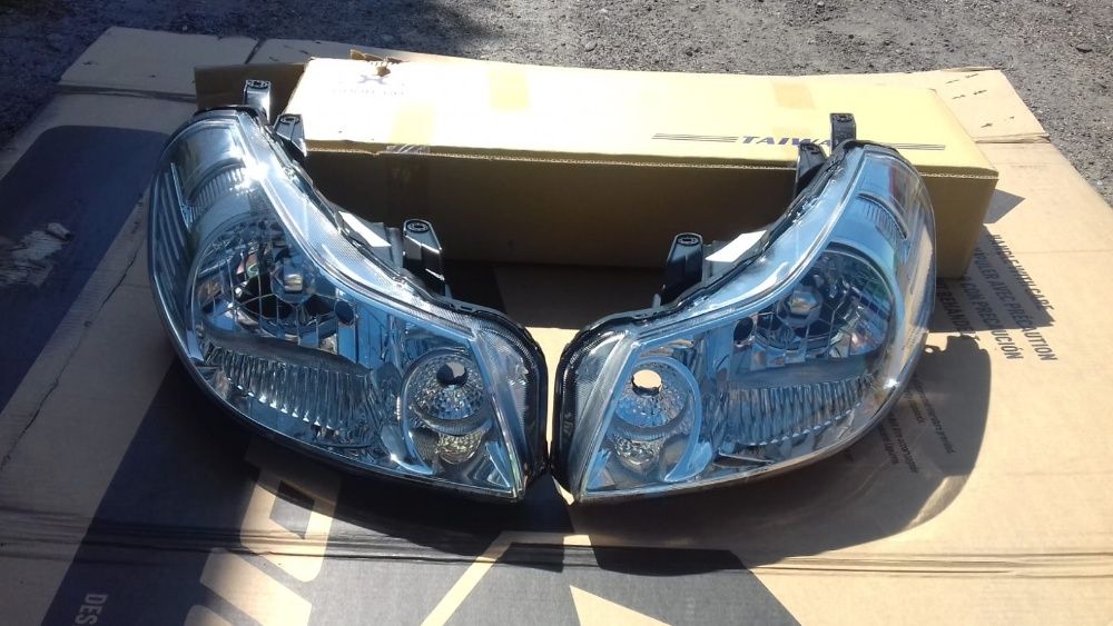 SUZUKI SX4 06 - lampa przednia lewa nowa
