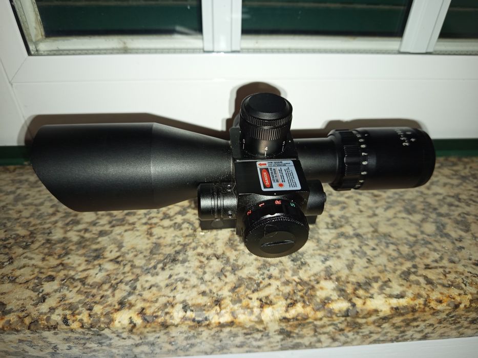Mira de rifle com laser
