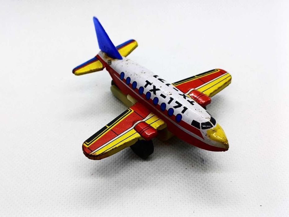 Avião brinquedo antigo em lata de fricção TX 171