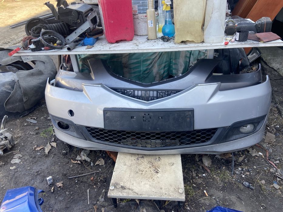 Передний бампер мазда 3бк телевизор уселитель капот