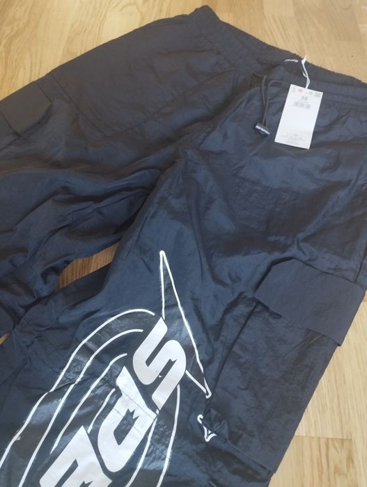 Nowe spodnie ortalionowe cargo Cropp