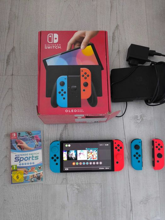 Nintendo Switch OLED + 4 Joy-Cony + Mario Kart 8 + Nintendo Switch Sports !