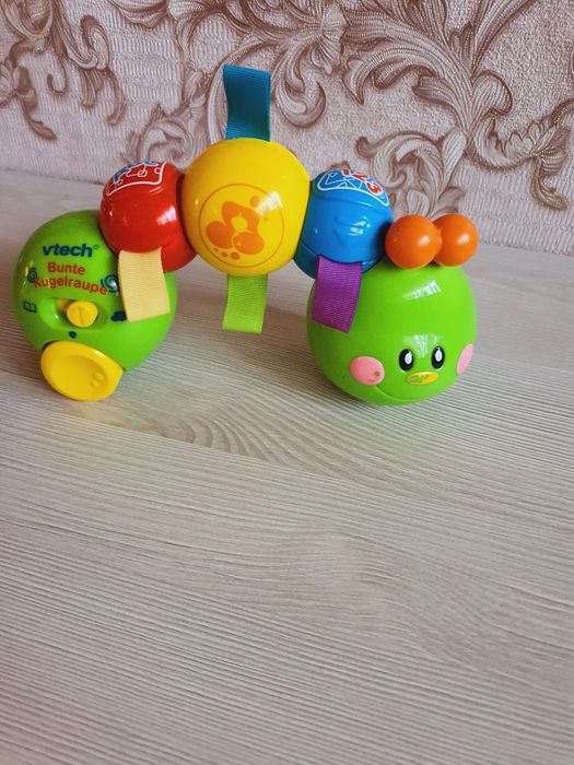 Розвивальна іграшка весела Юла Жабеня