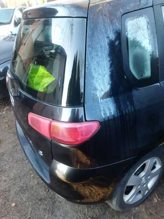 mazda 2DY tylny zderzak i  klapa (kolor czarny 17V)