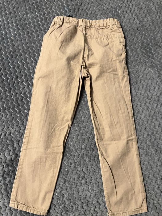 Spodnie eleganckie kremowe HM slim fit beżowe 116 chłopięce