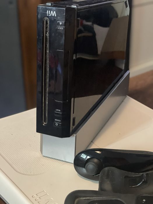 Wii with many games, two controllers, and Step64553264871682122