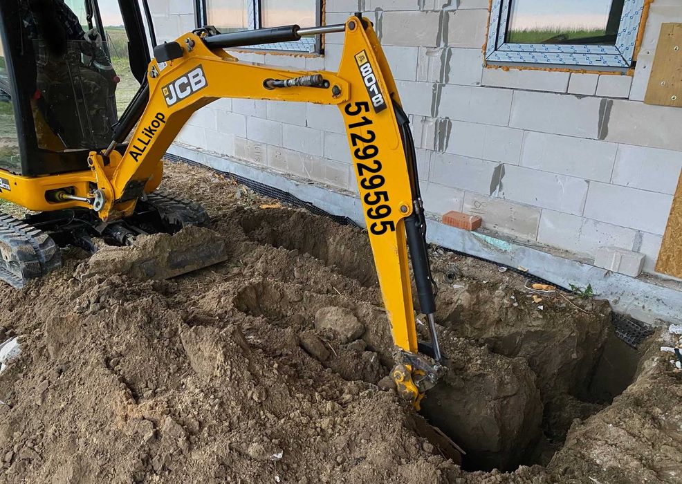 usługi minikoparka Maciej Rusin JCB 8018 CTS  kucie betonu kucie asfaltu wiertnica ziemi wiertnica gleby wykop przyłącza przygotowanie terenu odwierty