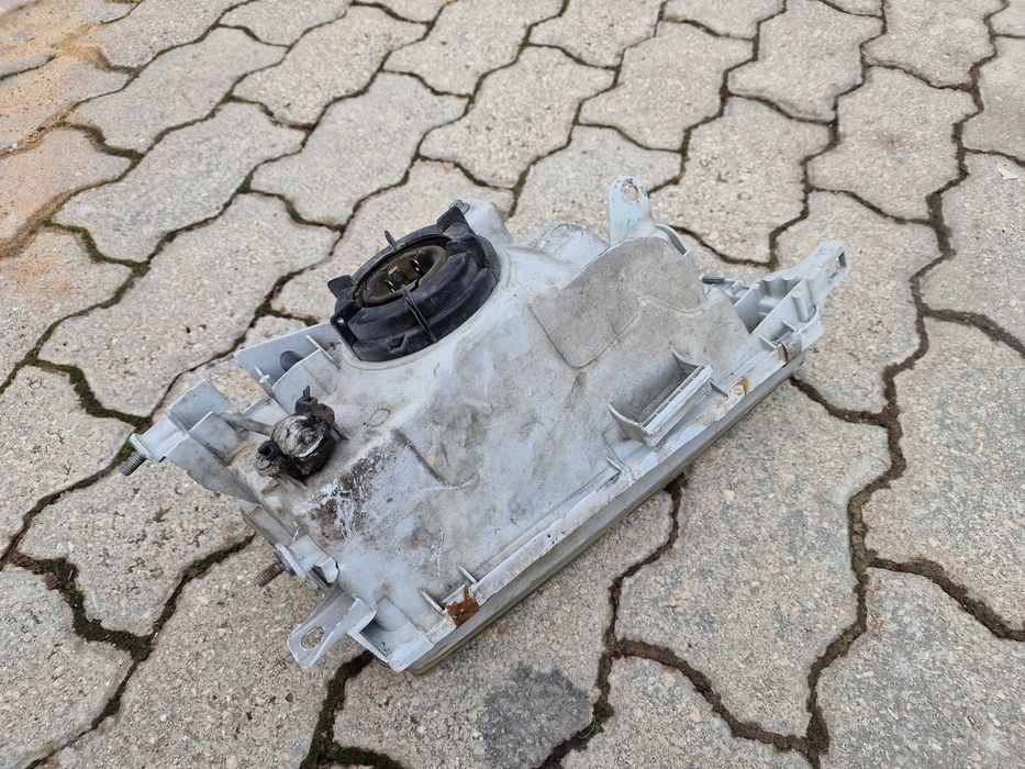 Farol esquerdo Toyota Corolla e100