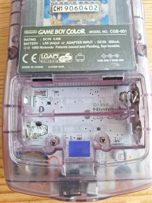 Gameboy roxo e jogo Harry Potter