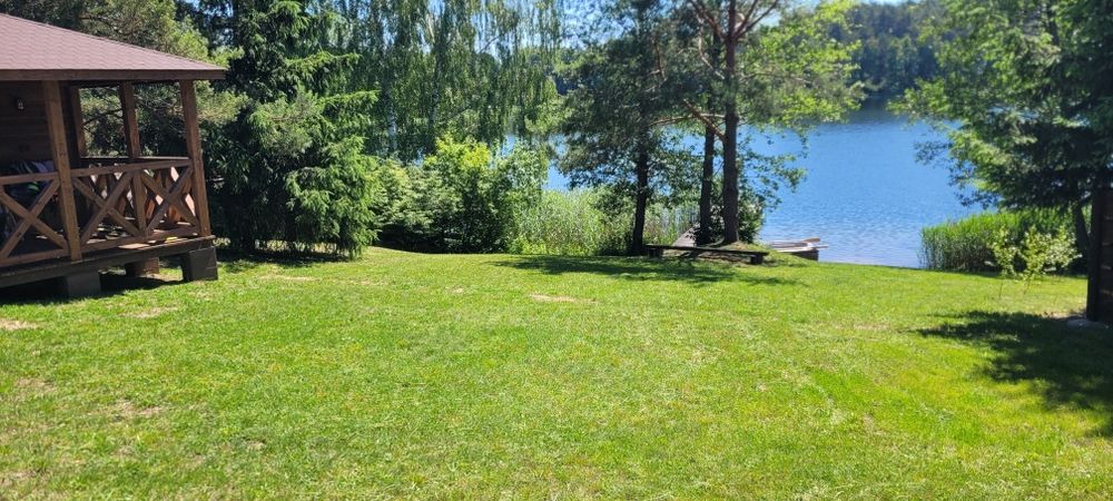 Domek na Mazurach z własną linią Mazury Domki nad jeziorem Noclegi Ełk Prywatna Plaża Łódka Kajaki Pomost Wakacje Wczasy Urlop na Mazurach Last Minute