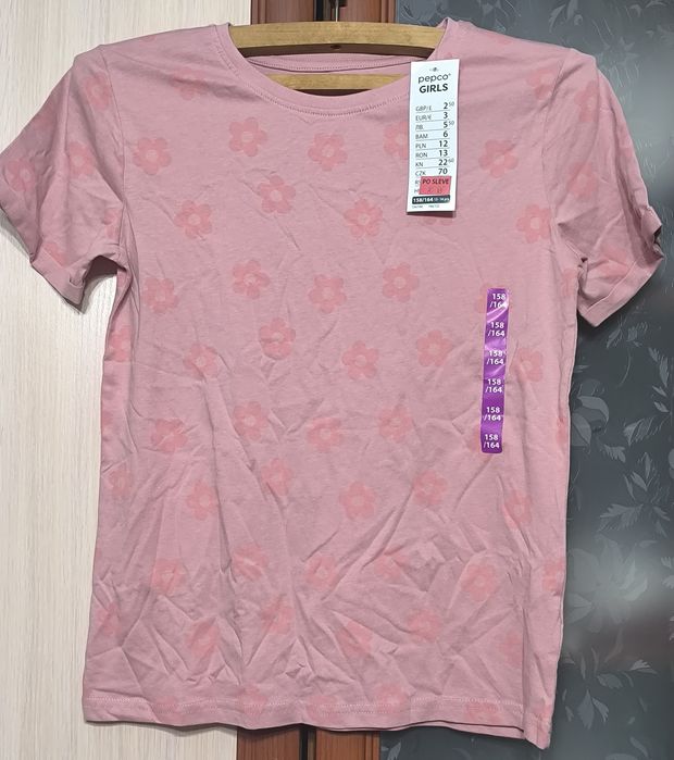Нова бавовняна футболка Pepco з квітами для дівчинки, розмір 158/164