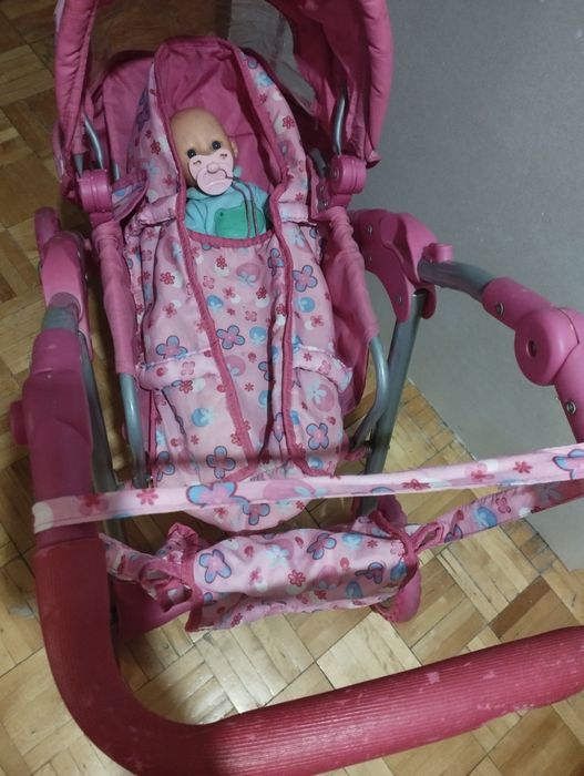 Różowy wózek dla lalek