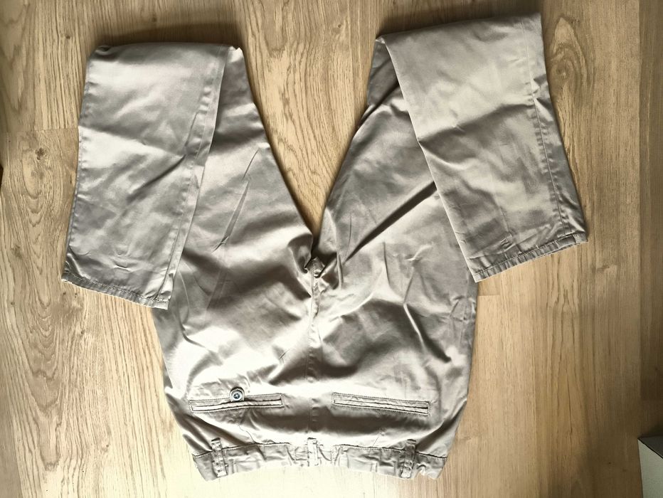 Kremowe eleganckie spodnie chłopięce Lindex, rozmiar 164